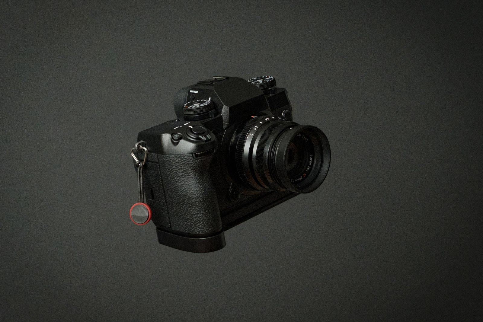 Small Mirrorless Camera On Grey Background